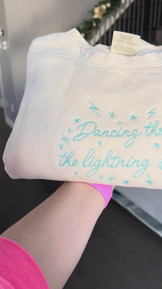 Dancing through the lightning strikes Embroidered Sweater Comfort Colors